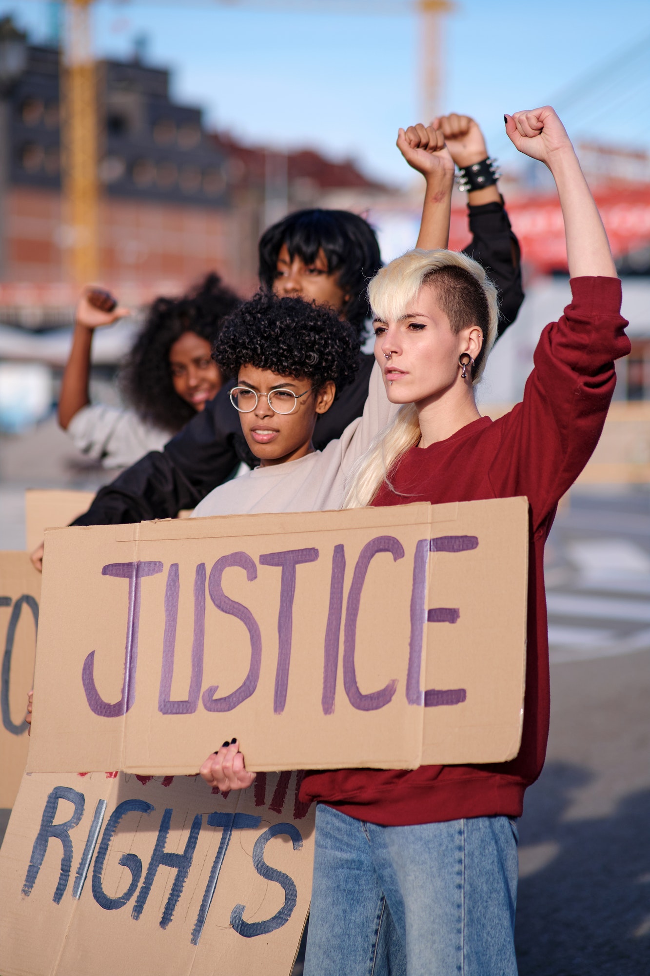 protesters-raising-their-arms-with-clenched-fists.jpg protesters-raising-their-arms-with-clenched-fists.jpg